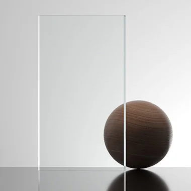 Minimalist composition with a clear glass panel standing upright beside a dark wooden sphere on a reflective surface