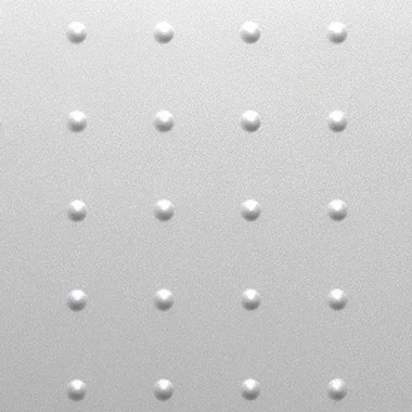 Close up of a gray metal surface with a regular grid of small raised circular bumps