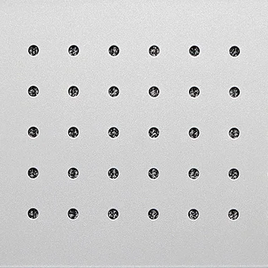 Grid of 35 small dark circles arranged in 5 rows and 7 columns on a light gray surface