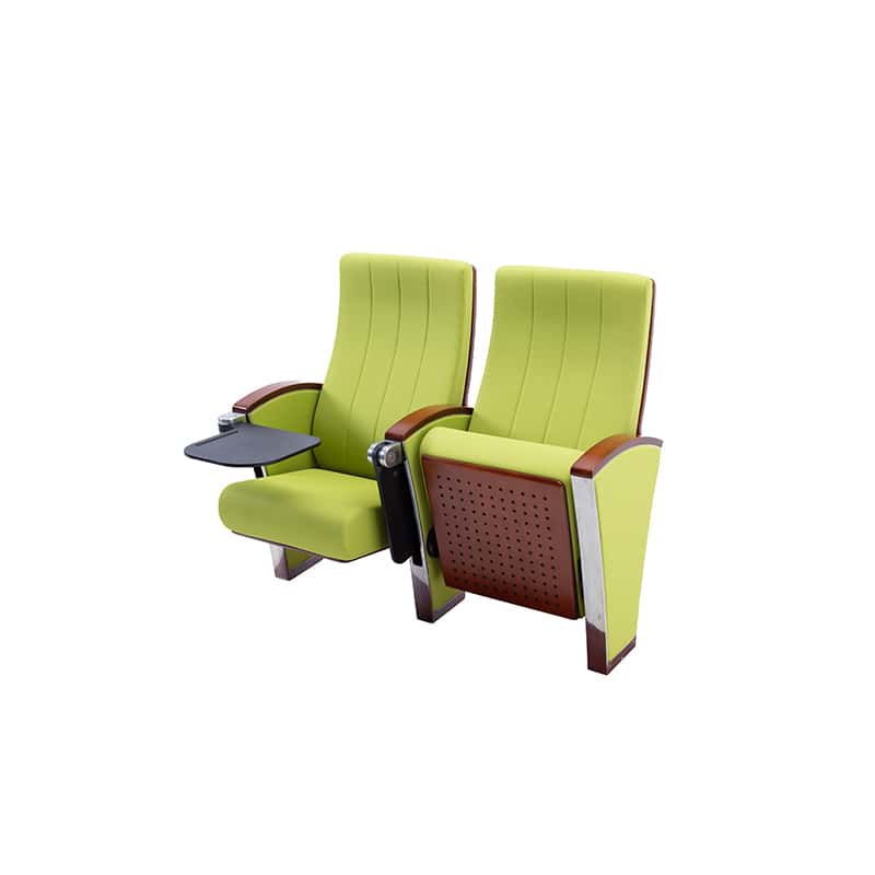 Two lime-green theater seats with wooden armrests, including a small fold-out tray on the left chair and a perforated brown back panel on the right chair's side.