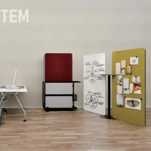 Open plan workspace with a white desk and three fabric room dividers against a light wall
