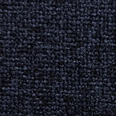 Close up of a dark navy looped fabric texture carpet or textile surface with dense fibers