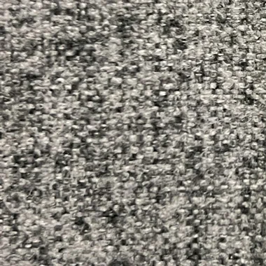 Close up of gray looped carpet fibers with a speckled pattern