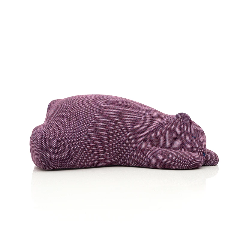 Purple knitted beanie hat lying on its side on a white background
