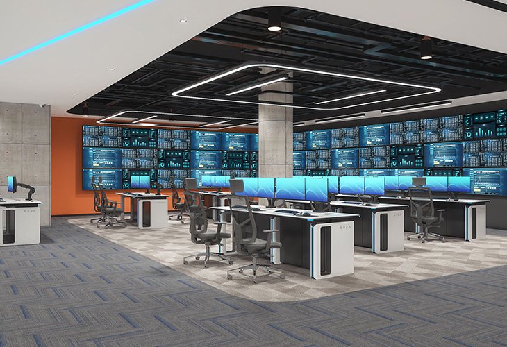 Modern command center with rows of desks and a wall of data-monitoring screens behind them.” (Note: Please remove the closing quote if needed)