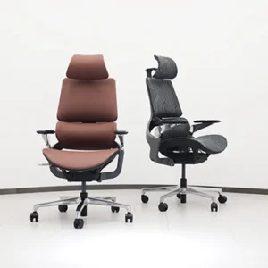 Two ergonomic office chairs on wheels in a bright white room a brown leather like chair with a headrest and a black mesh chair with adjustable arms