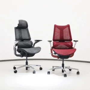 Pair of ergonomic office chairs with black and red patterned upholstery adjustable armrests and chrome wheeled bases in a white studio