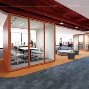 Open plan office with glass walled meeting pods framed in orange people working at desks and relaxing in a lounge area