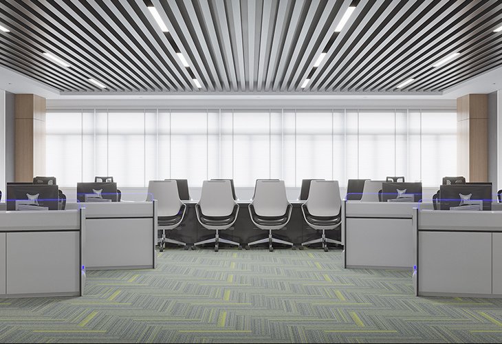 Open-plan office with rows of desks and ergonomic white chairs facing a bright window wall.