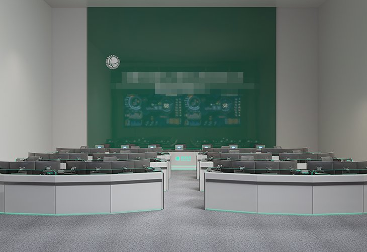 Empty modern lecture hall with curved desks facing a large green presentation wall and a faint circuit display at the front.