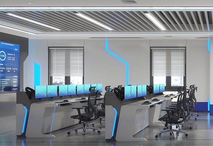 Modern control room with rows of computer workstations, ergonomic chairs, and blue LED accents along the desks and walls.
